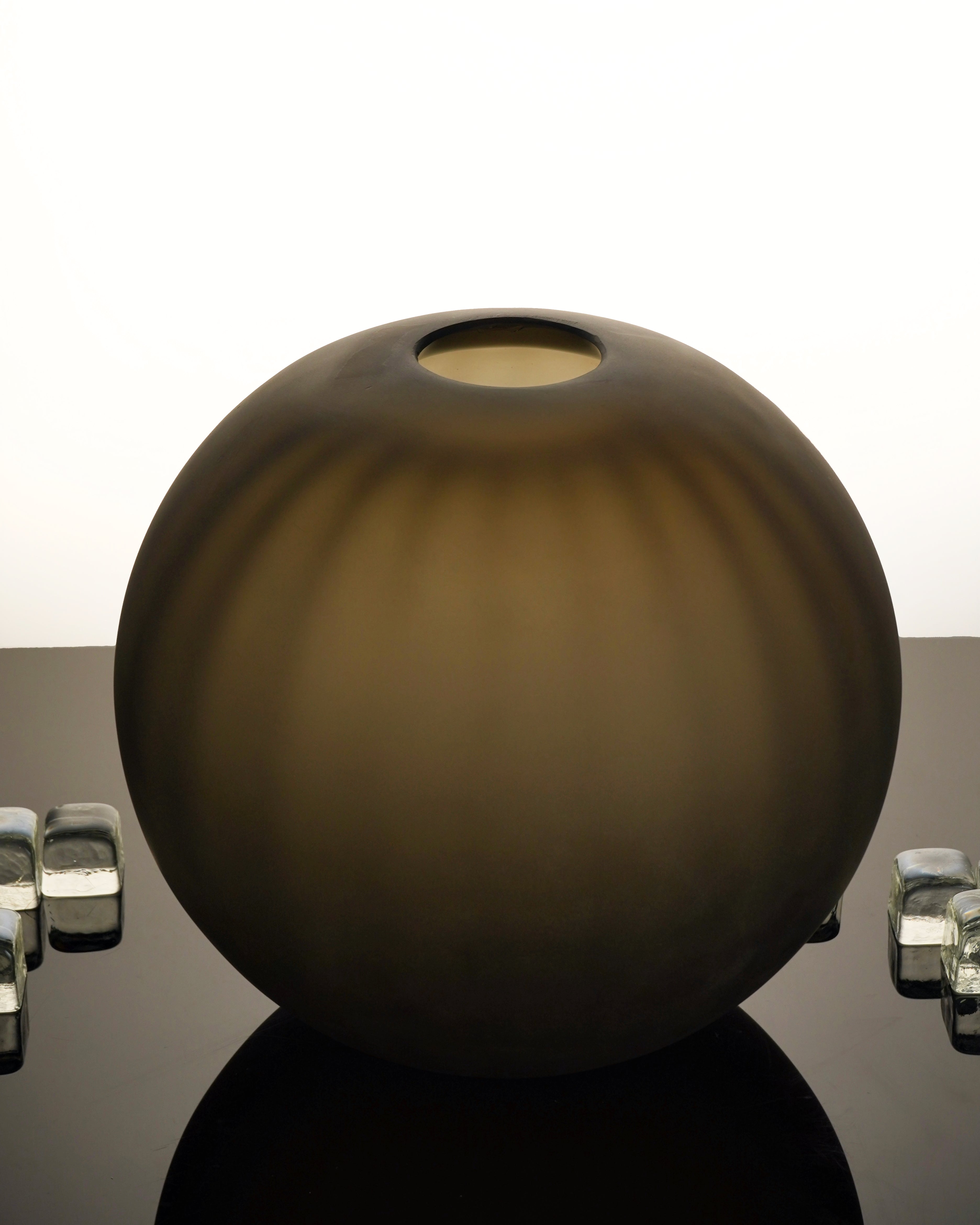 Handcrafted Correnti Murano Glass round vase with sleek steel and tobacco color scheme, made using artisanal techniques, perfect as a luxurious statement piece for art and design lovers.