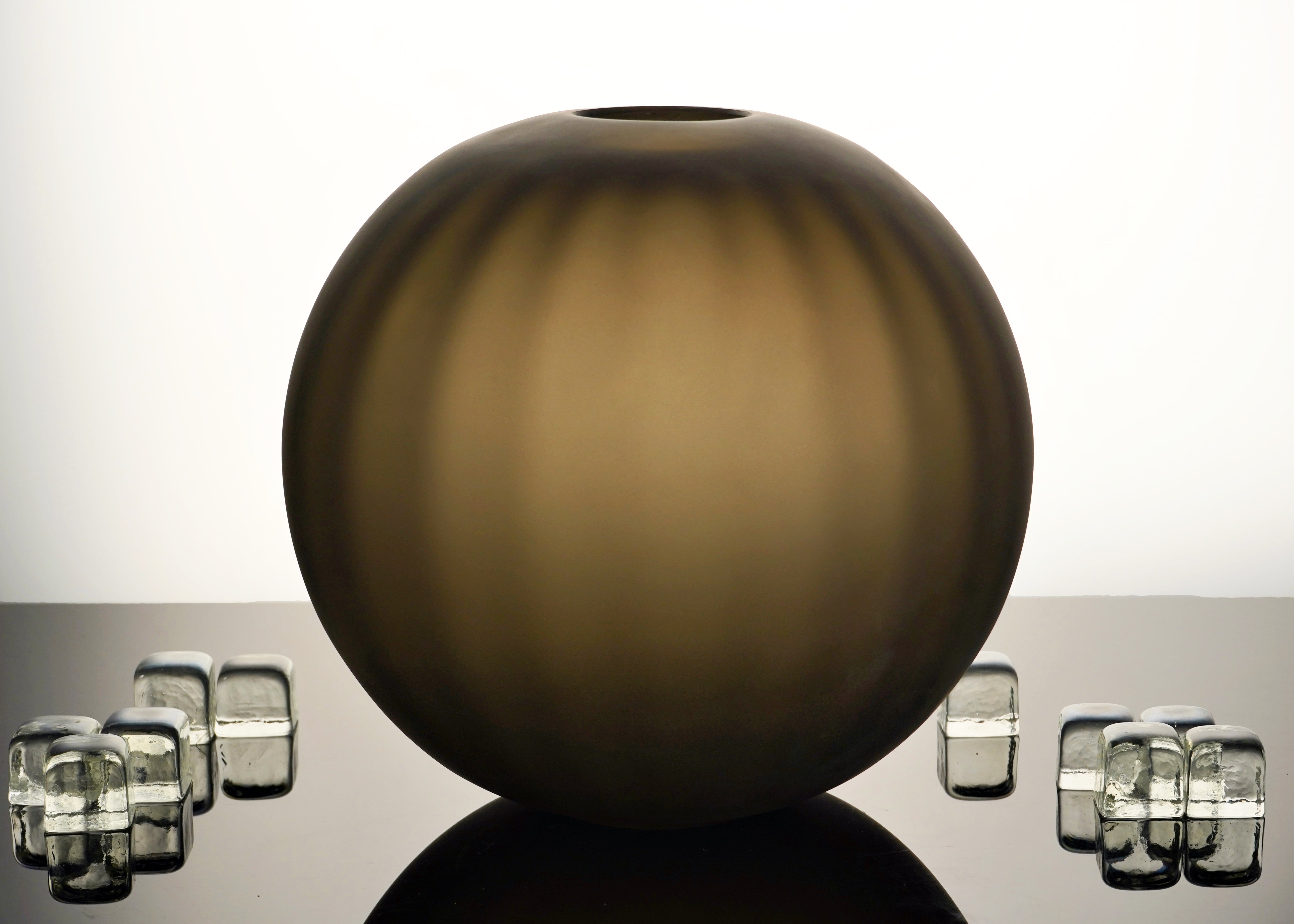 Handcrafted Correnti Murano Glass round vase with sleek steel and tobacco color scheme, made using artisanal techniques, perfect as a luxurious statement piece for art and design lovers.