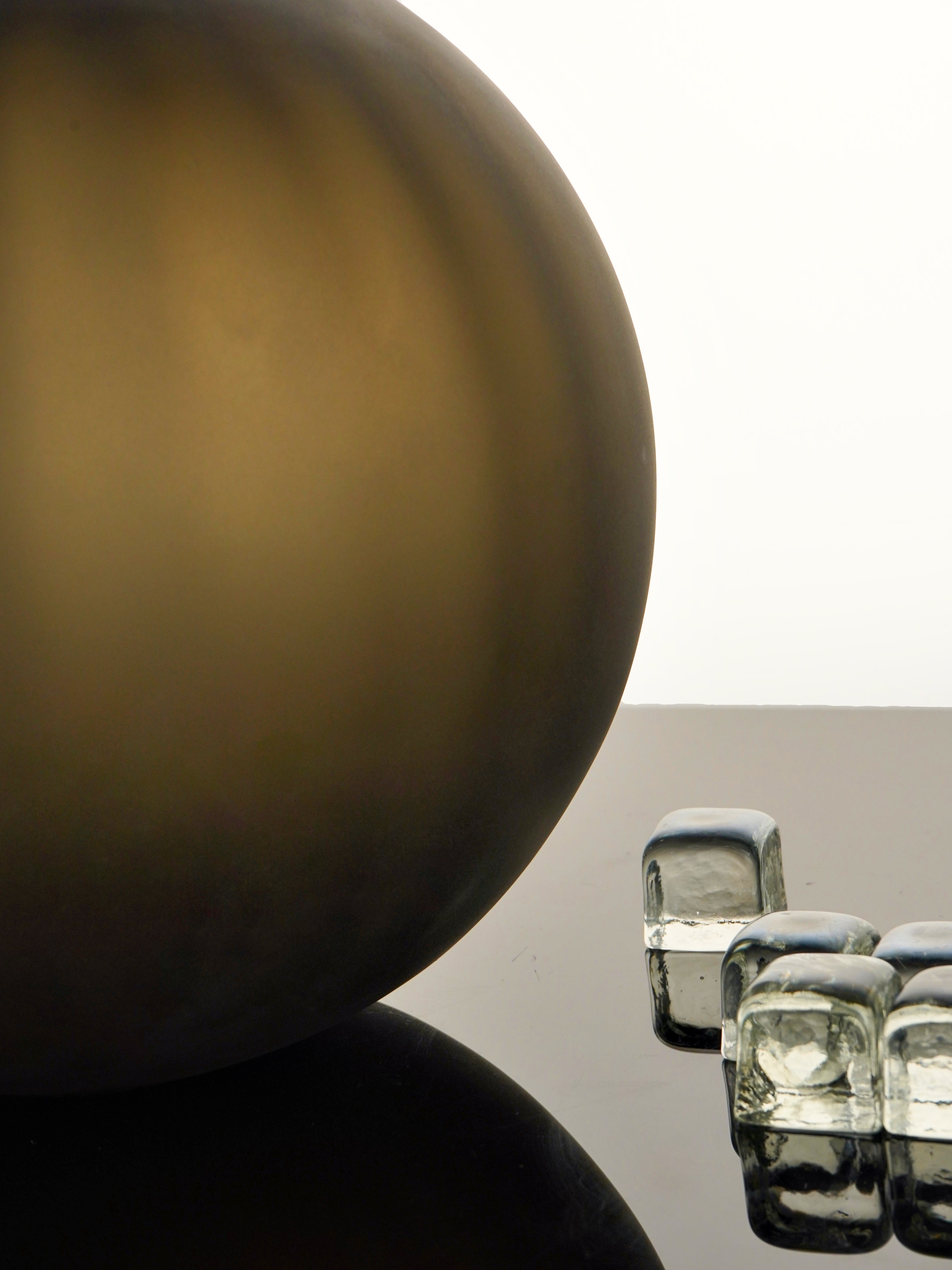 Handcrafted Correnti Murano Glass round vase with sleek steel and tobacco color scheme, made using artisanal techniques, perfect as a luxurious statement piece for art and design lovers.