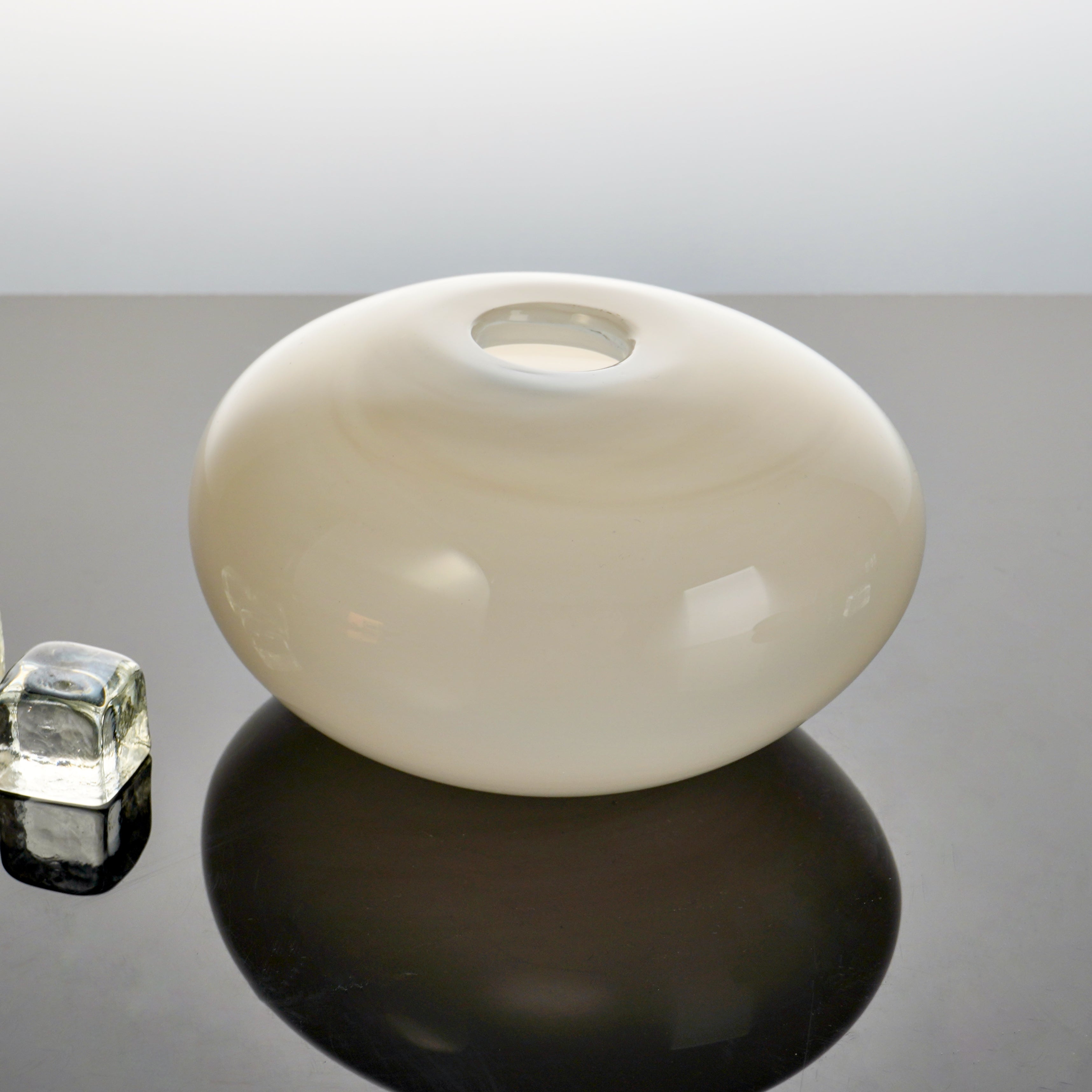 Armani Casa Vase, handmade in Italy with Murano glass. A sleek round shape with a delicate silk finish, adding sophistication and elegance to any space.