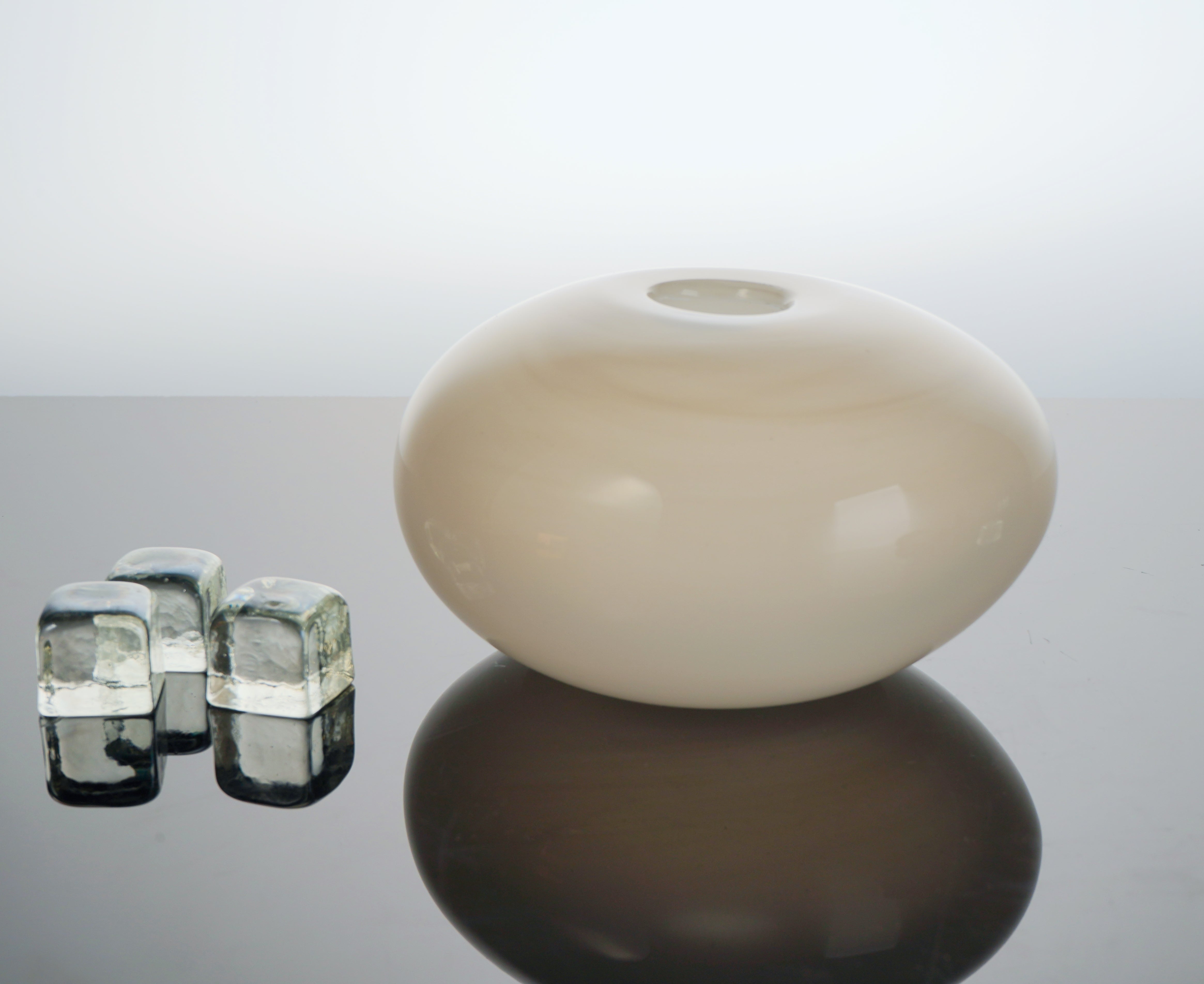 Armani Casa Vase, handmade in Italy with Murano glass. A sleek round shape with a delicate silk finish, adding sophistication and elegance to any space.