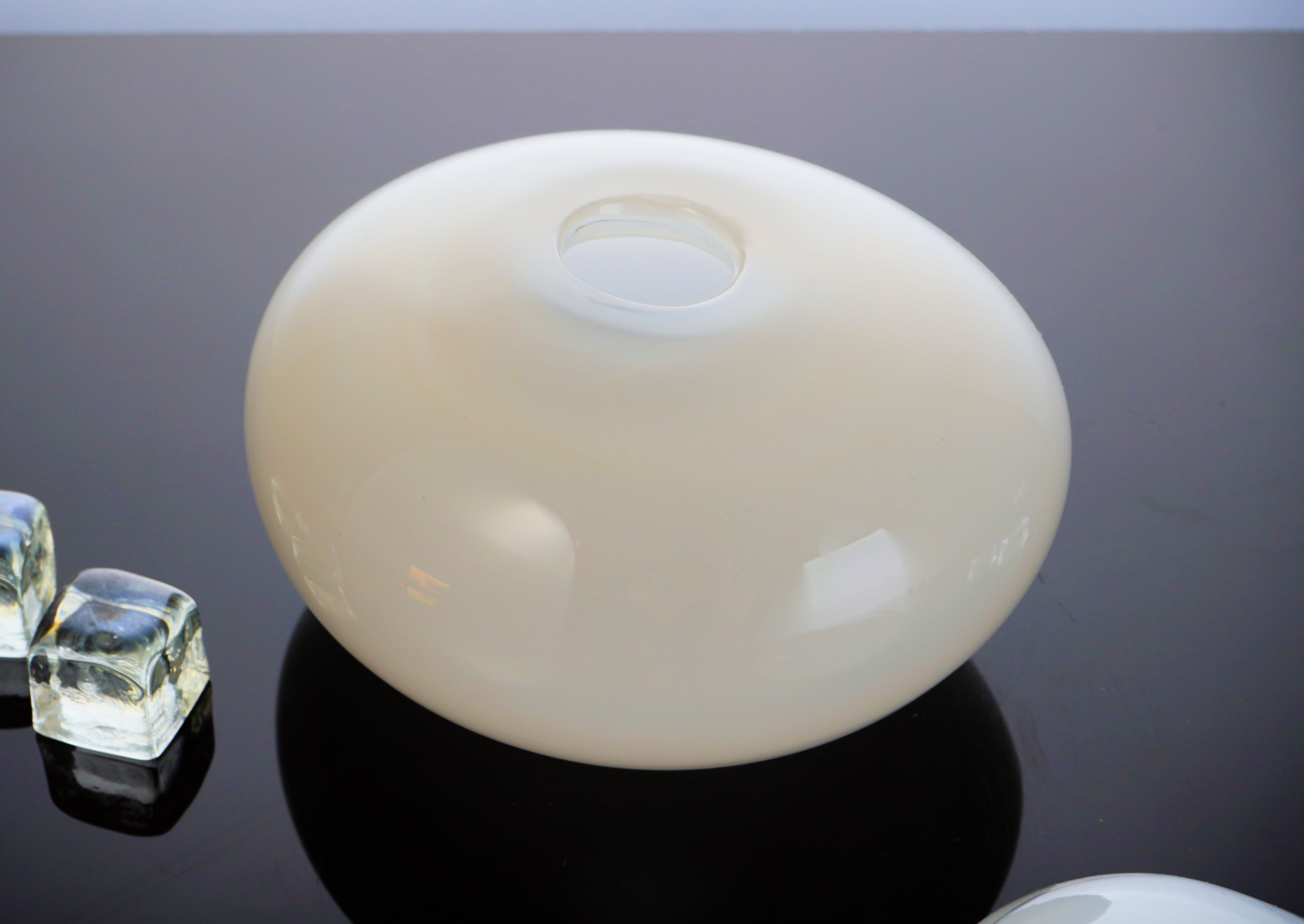 Armani Casa Vase, handmade in Italy with Murano glass. A sleek round shape with a delicate silk finish, adding sophistication and elegance to any space.